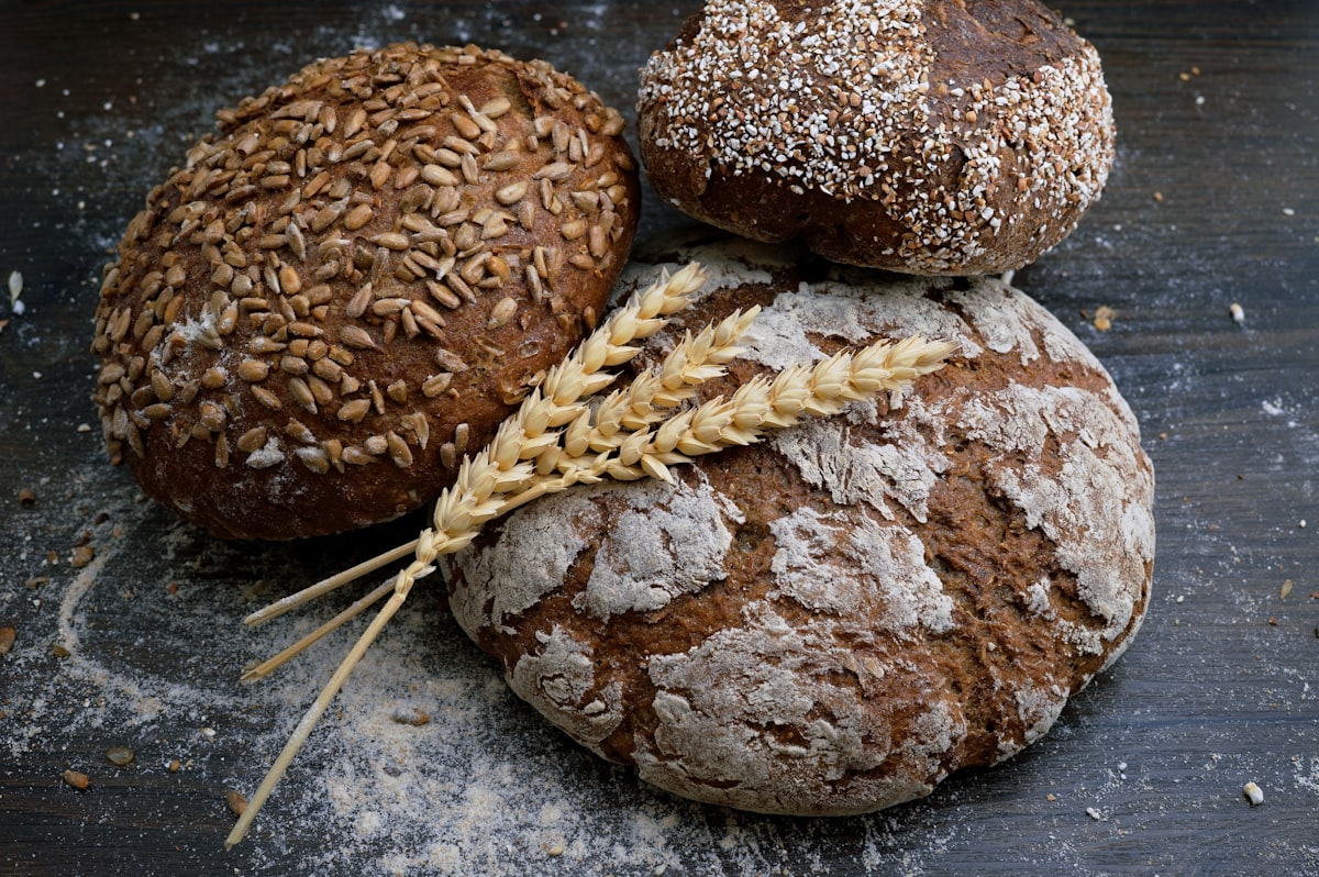 Whole grains and legumes in wooden bowls